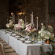 What a Host Home: Wedding Tablescape with gold cutlery, linen table napkins, porcelain round plates, gold candle holders