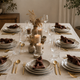 Rustic Modern Table Setting with Gold cutlery Stainless Steel, Brown Cotton gauze muslin napkins set, and ceramic round plates from What a Host Home