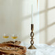 A Comparative Guide to Iron, Brass, and Aluminum Candle Holders