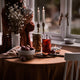 What a Host Home Decor: Autumn Tablescape Design with gold brass modern candle holders, gold rose cutlery sets, natural table linens and wooden chopping board