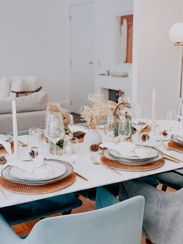 What a Host Home: Easter Tablescape with Straw Bunnies, Rattan Placemats, gold cutlery and cotton gauze napkins and table runner