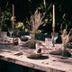 What a Host Home: Al Fresco Tablescape with gold modern candle holders, washed linen tablecloth, ceramic plates and gold rose stainless steel cutlery sets