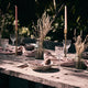 What a Host Home: Al Fresco Tablescape with gold modern candle holders, washed linen tablecloth, ceramic plates and gold rose stainless steel cutlery sets