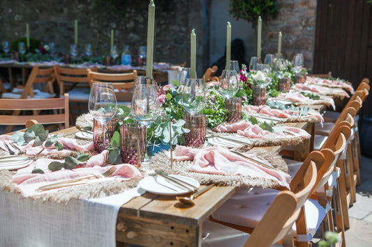 Wedding Tablescape: High quality table design with tableware, gold cutlery sets, cotton table runner and napkins, iron candle holders and round rattan placemats from What a Host Home and Hygge Decor