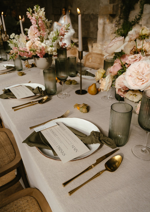What a Host Home: Modern Wedding Table with Gold Cutlery, Porcelain Plates and Gold Rustic Iron Candle Holders