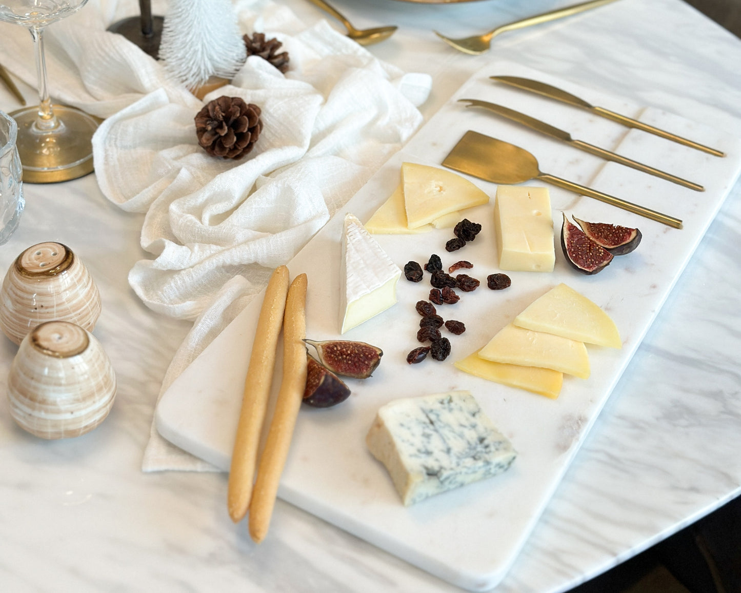 White Marble Cheese and Charcuterie Board with Cheese Cutlery Set in Stainless Steel from What a Host Home