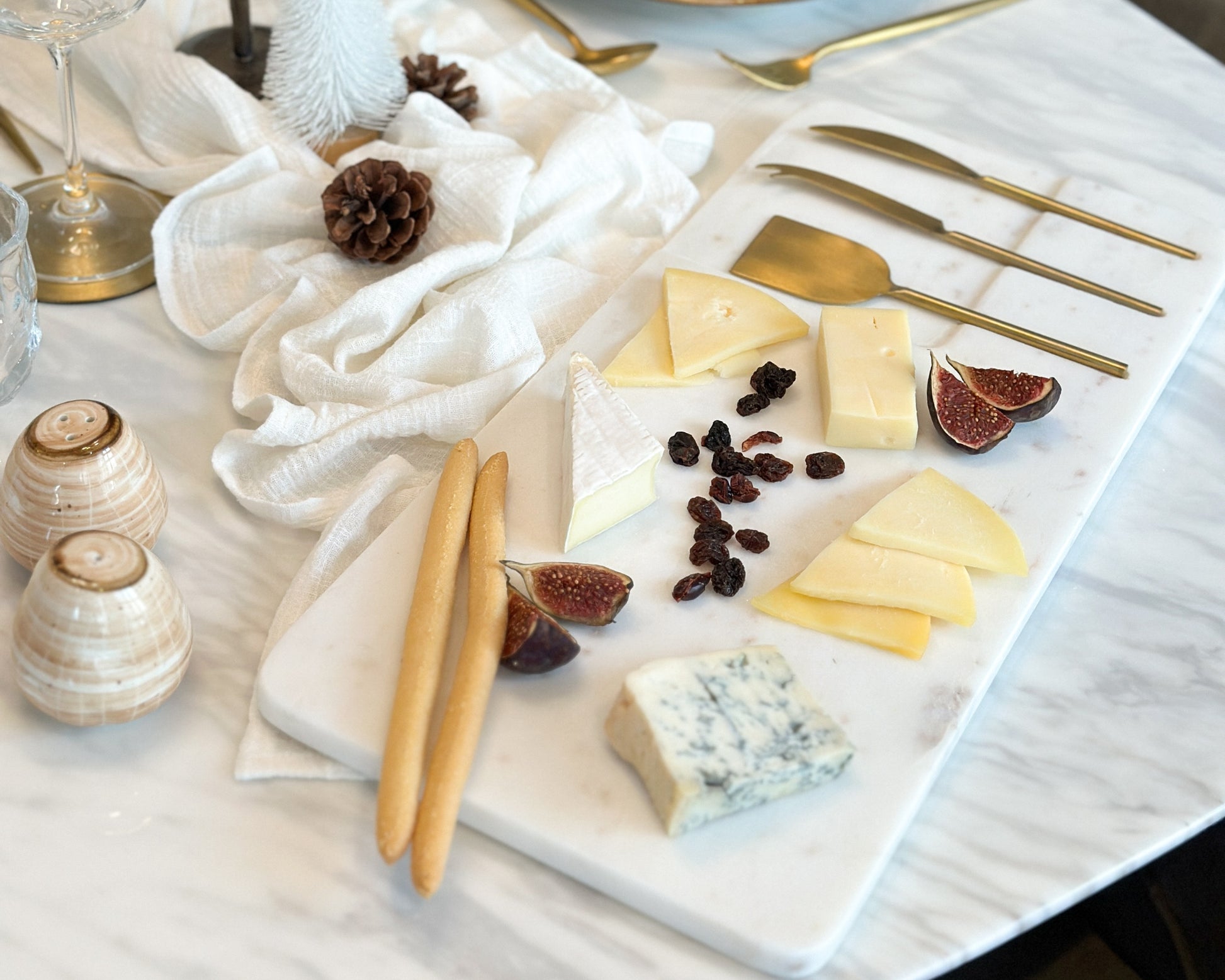 White Marble Cheese and Charcuterie Board with Cheese Cutlery Set in Stainless Steel from What a Host Home