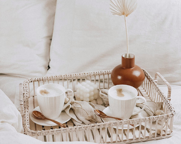 Hana Breakfast Set. Wood Rectangle Rattan Tray With Handle, Whitte Bubble Freesia Candle soy wax, Porcelain Mug White, Stainless Steel Tea Spoon Rose Gold, Porcelain Saucer White, linen napkins, boho wood napkin holders, dry natural palm leaf, morandi brown ceramic vase - What a Host